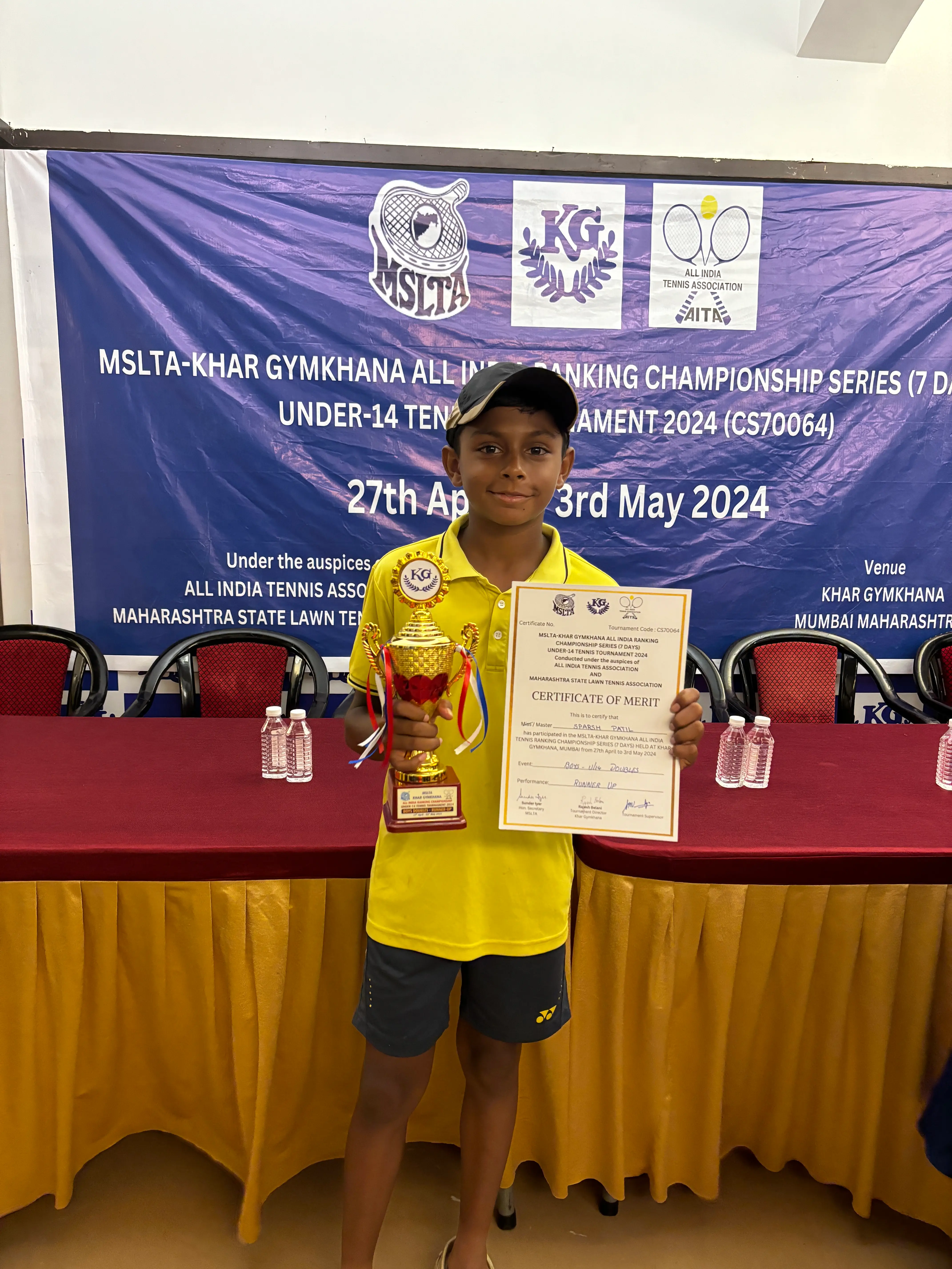 Sparsh collecting trophy for runner up in doubles category at the Under 14 Championship Series (CS7) 2024 - Khar Gymkhana